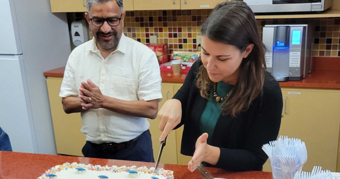 Dr Chiappinelli cutting a cake to celebrate her tenure