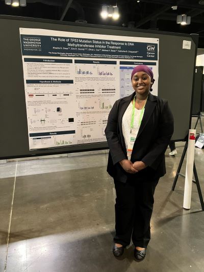 Khadra, an undergrad presenting her poster at AACR