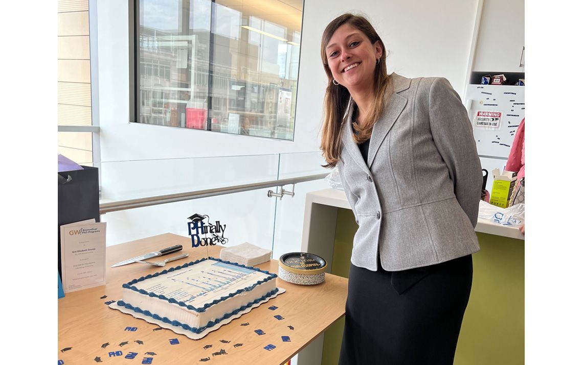 Erin next to her cake