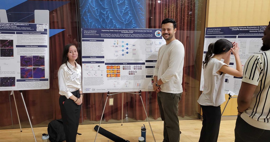 Karina Vargas in front of her poster at SPARC