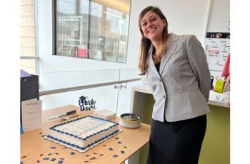 Erin next to her cake