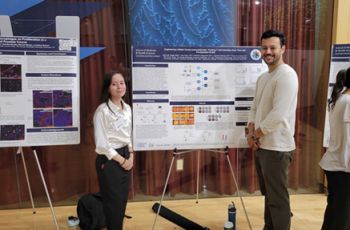 Karina Vargas in front of her poster at SPARC