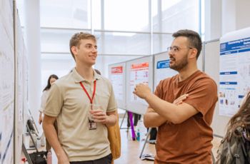 Kevin Nestler talking to a collegue 